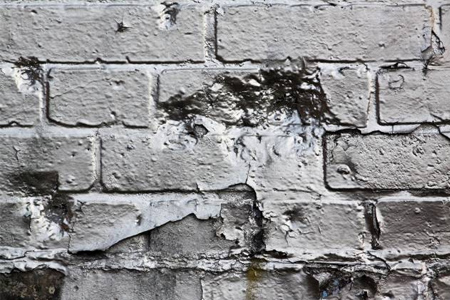 brick paint peeling shiny silver wall